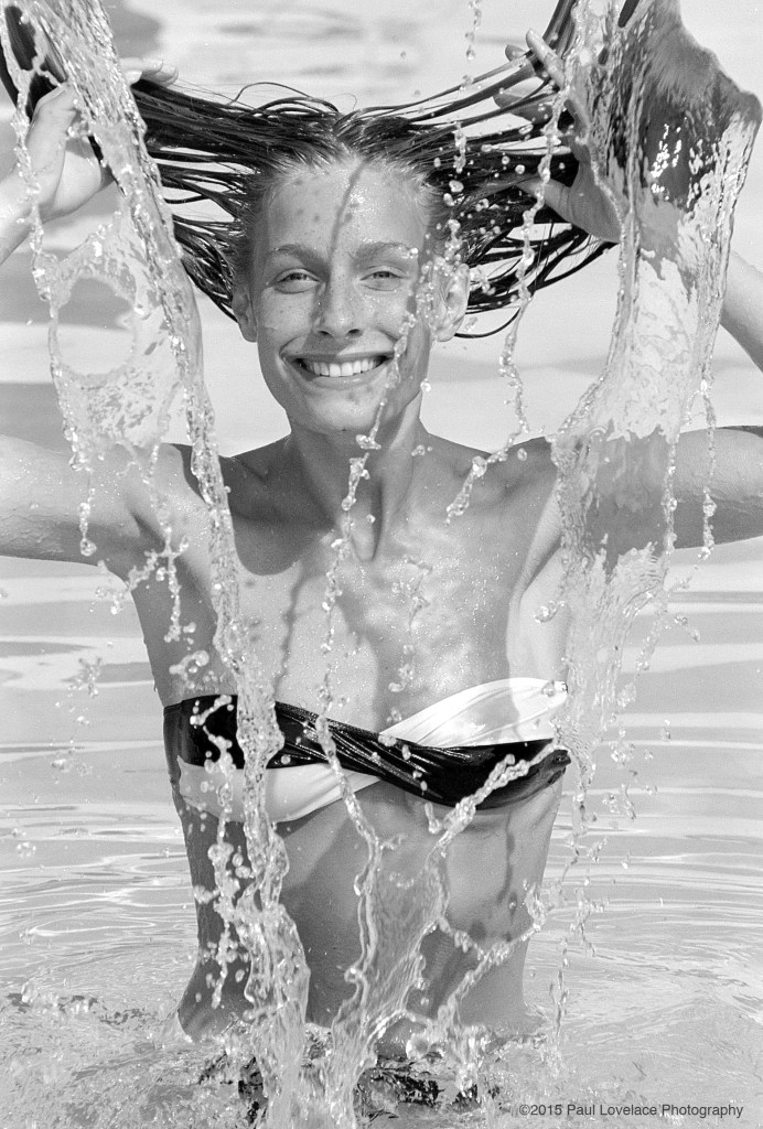 A young lady cools down on an English summers day in London. This was taken on black and white film.